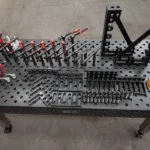 High-angle view of a Tenaxis welding table with fixture toolkits