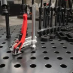 Close shot of a fast clamp in a welding table