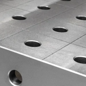 Close-up of a Tenaxis raw cast iron welding table