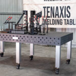 1200x2400 Nitrided Cast Iron showing welding table top with toolkit and stainless steel legs with caster wheel