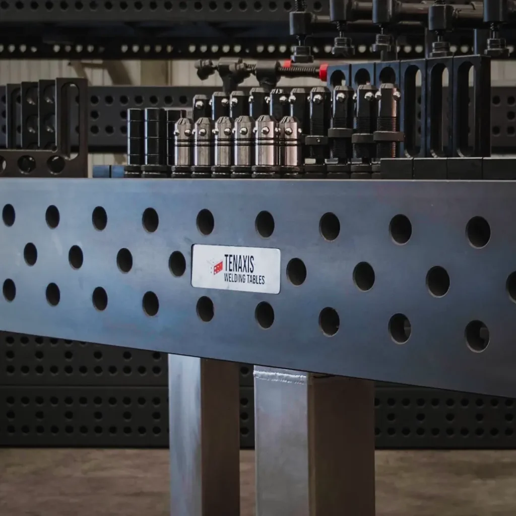 Nitrided Cast Iron welding table with close up view of tenaxis logo and some fixtures