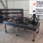 1200x2400mm nitrided steel welding table on stainless steel adjustable legs with casters and a professional fixture kit.