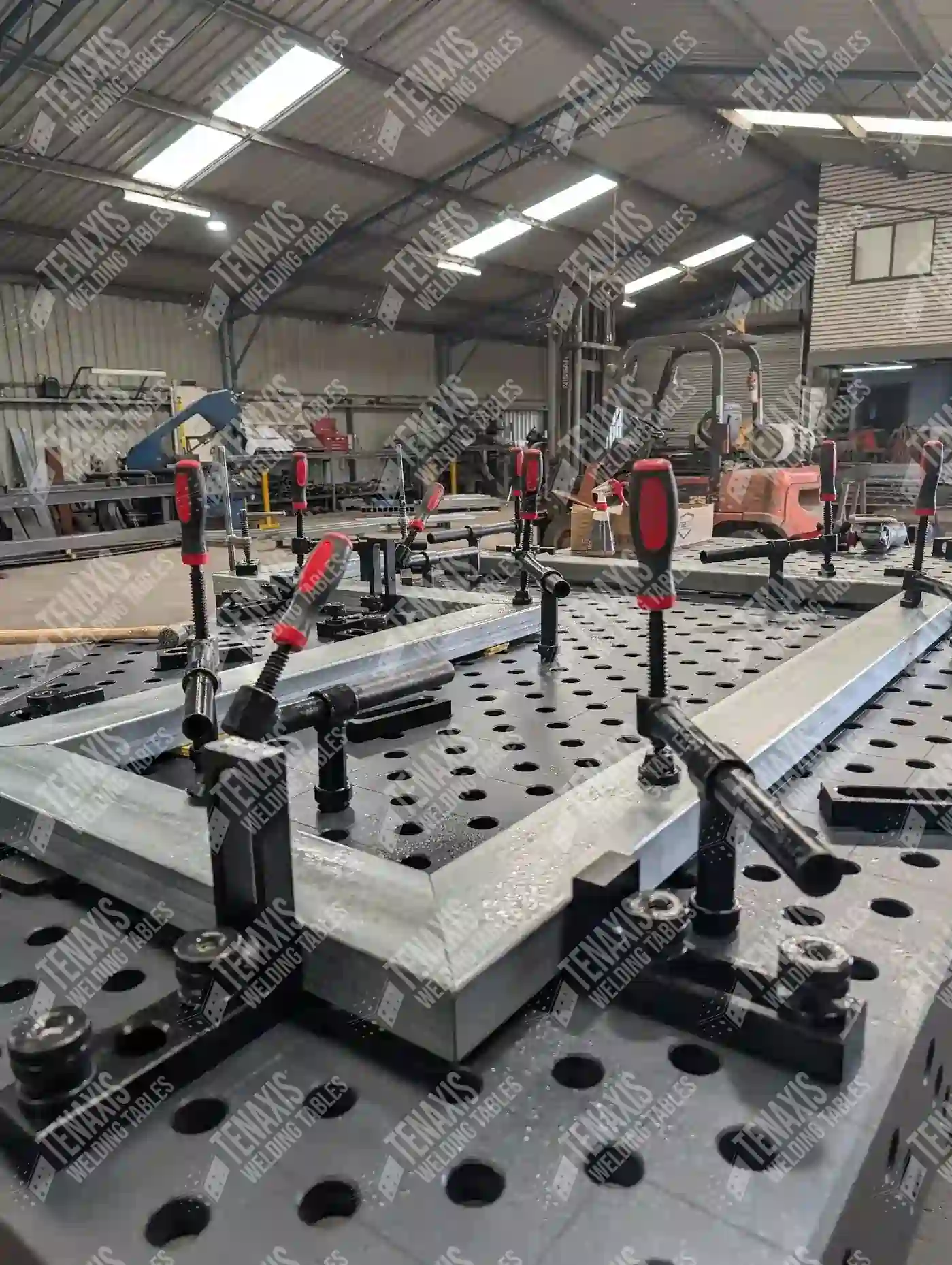 Precision metal frame fixtured using a combination of System 28 welding pins, stops, and screw clamps.