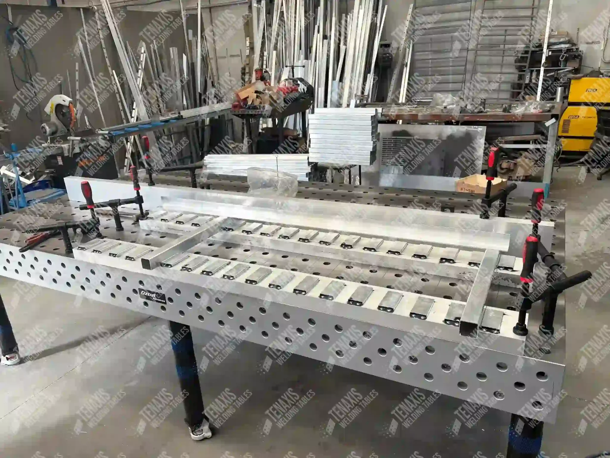 Aluminum ladder frame fabrication showing the high-tensile stability of a Raw Cast Iron Tenaxis modular welding fixture table